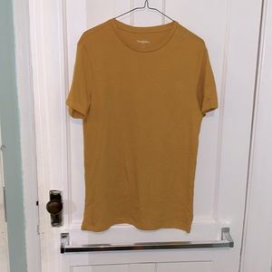 gold colored t-shirt